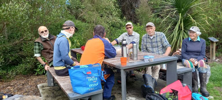 Volunteers taking a break at Snowden's Bush Working Bee 2025